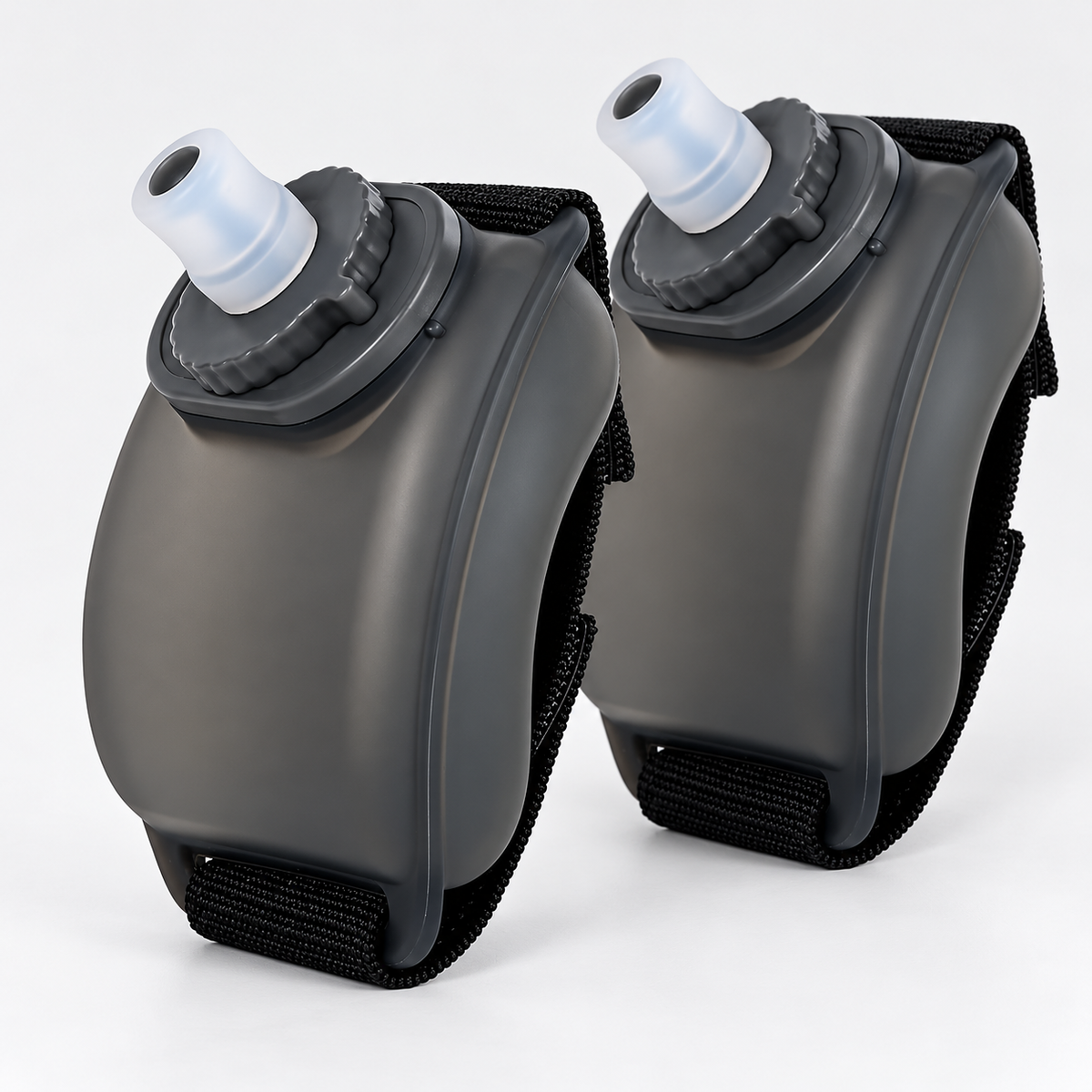 Two Flowband wrist water bottles in semi-transparent black with adjustable black straps